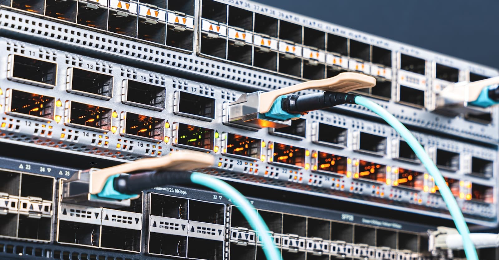 Fiber optic cables connected to network switch ports